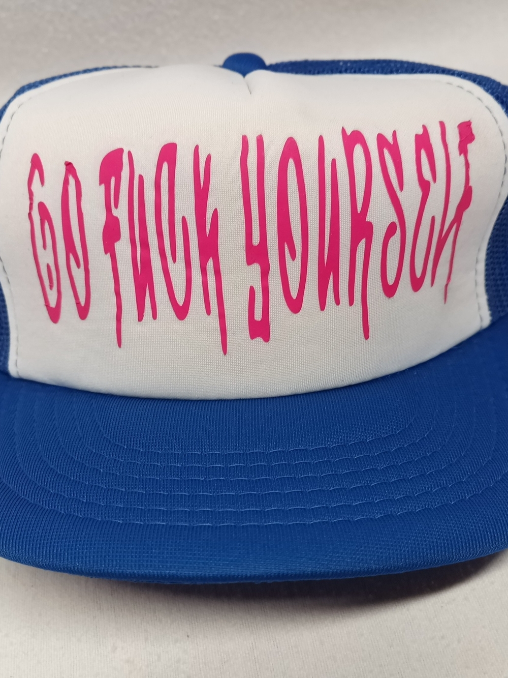 Blue and White Trucker Hat with Hot Pink Graphic Lettering